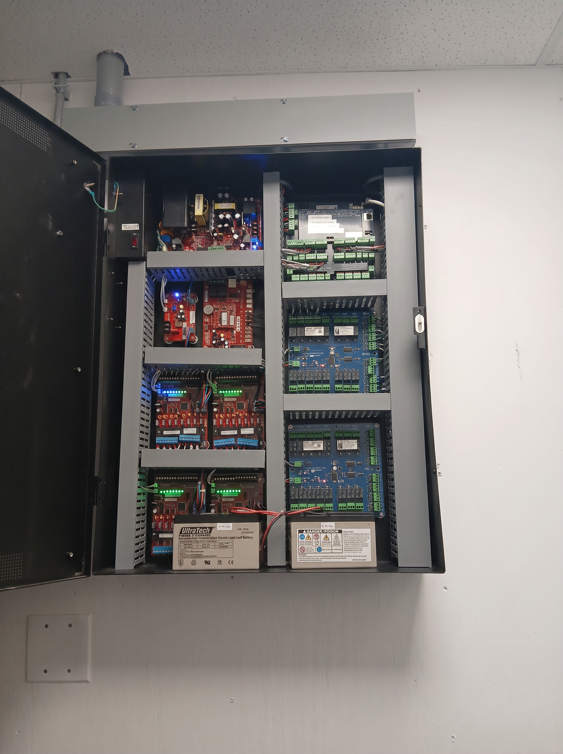 Open access control panel showing wiring and boards.