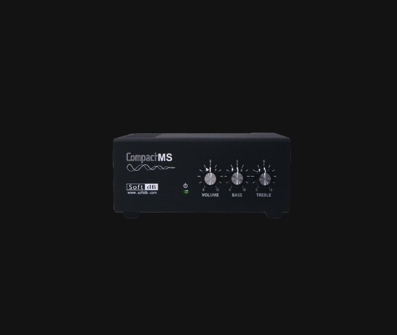 Compact black sound masking controller with volume, bass, and treble knobs on the front.