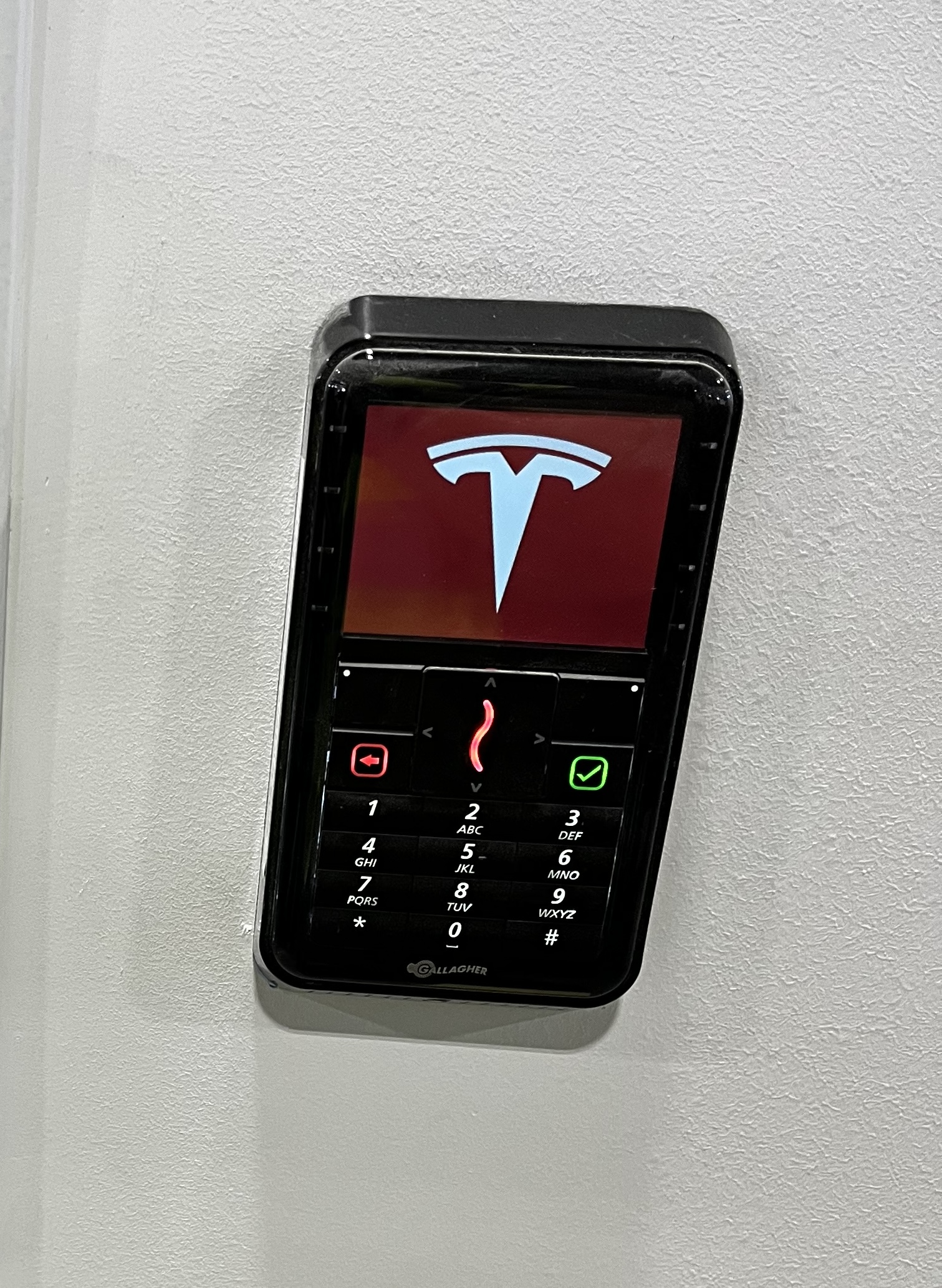 Powered-on interior keypad reader with backlit display and illuminated keys.