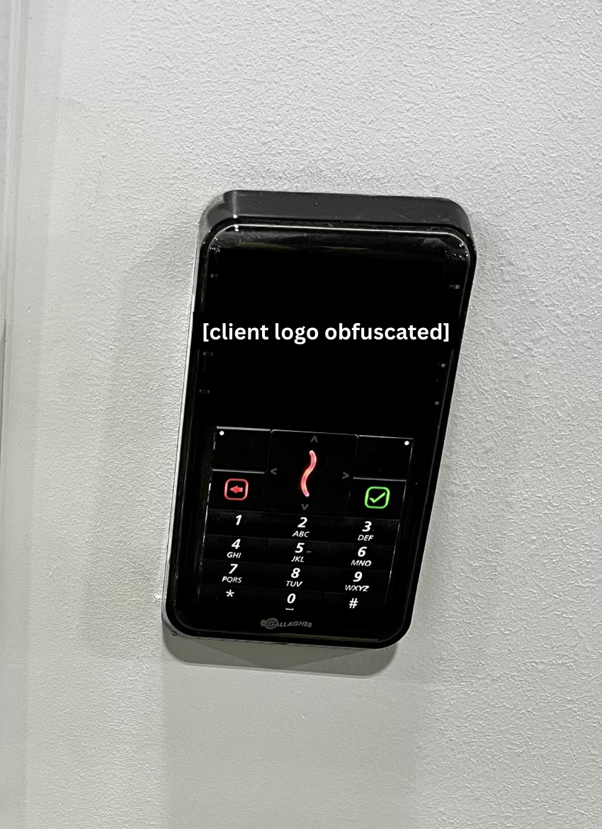 Powered-on interior keypad reader with backlit display and illuminated keys.