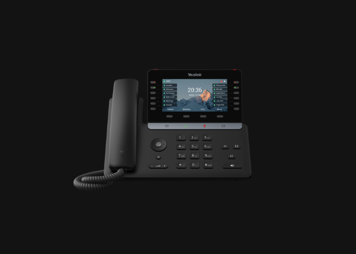 Yealink VoIP desk phone with a color display showing a directory of programmed line keys.