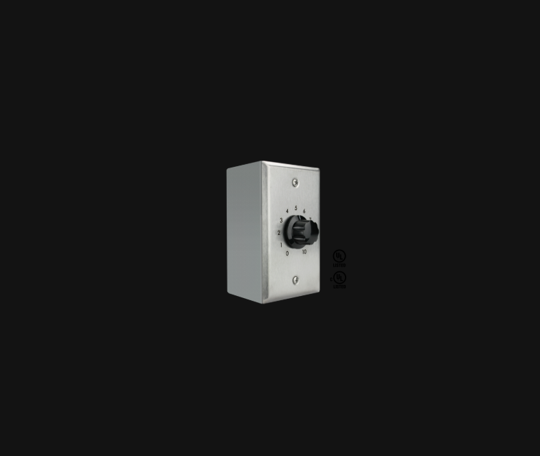 Wall-mounted metal sound masking volume control with a black rotary knob numbered from zero to ten.